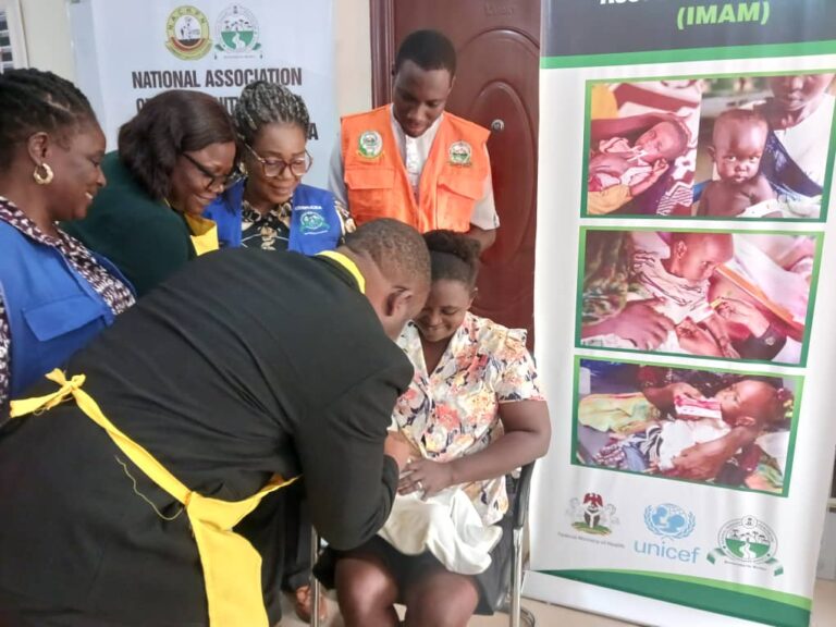 ES vaccinating baby with oral polio vaccine